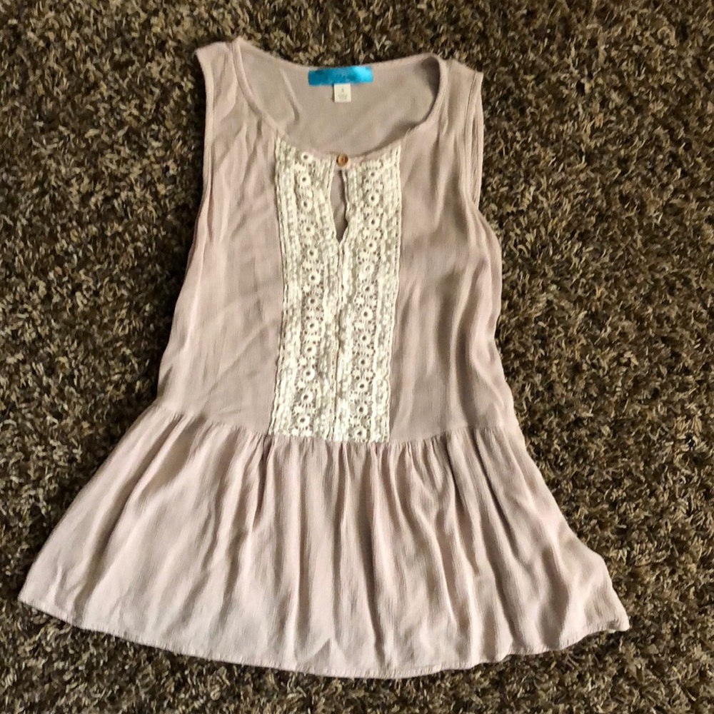 Flair bottom tank top with lace detail.